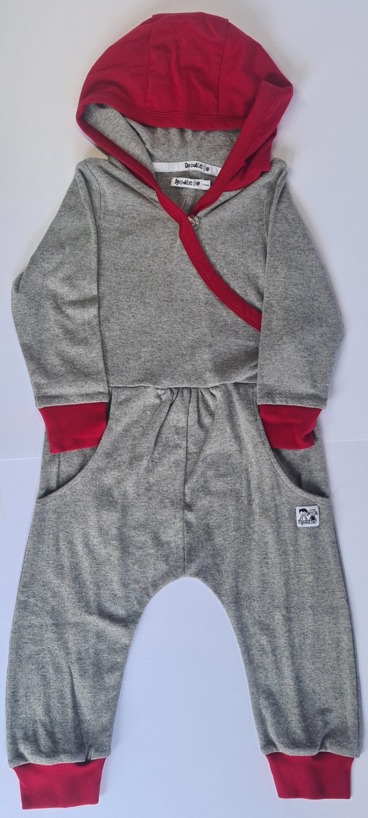 Experience the ultimate blend of style and comfort with our All in one Grey Red Onesie. Its versatile design and stylish color combination make it a must-have in your wardrobe. Get yours today for a cozy and fashionable look!