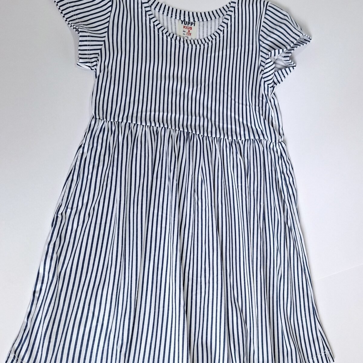 Step into elegance with our Striped Blue Dress. This dress combines a versatile style with a comfortable fabric, making it the perfect choice for any occasion.