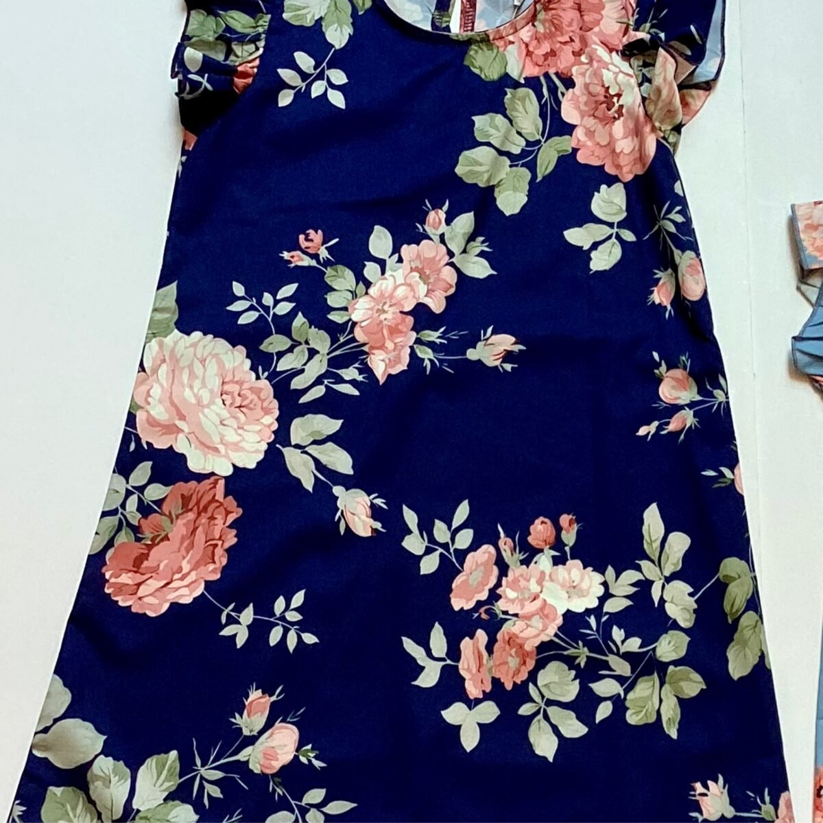 Elevate your little girl's wardrobe with this charming Navy Floral Dress. The perfect blend of navy sophistication and floral elegance, she'll feel like a princess in this delightful dress.