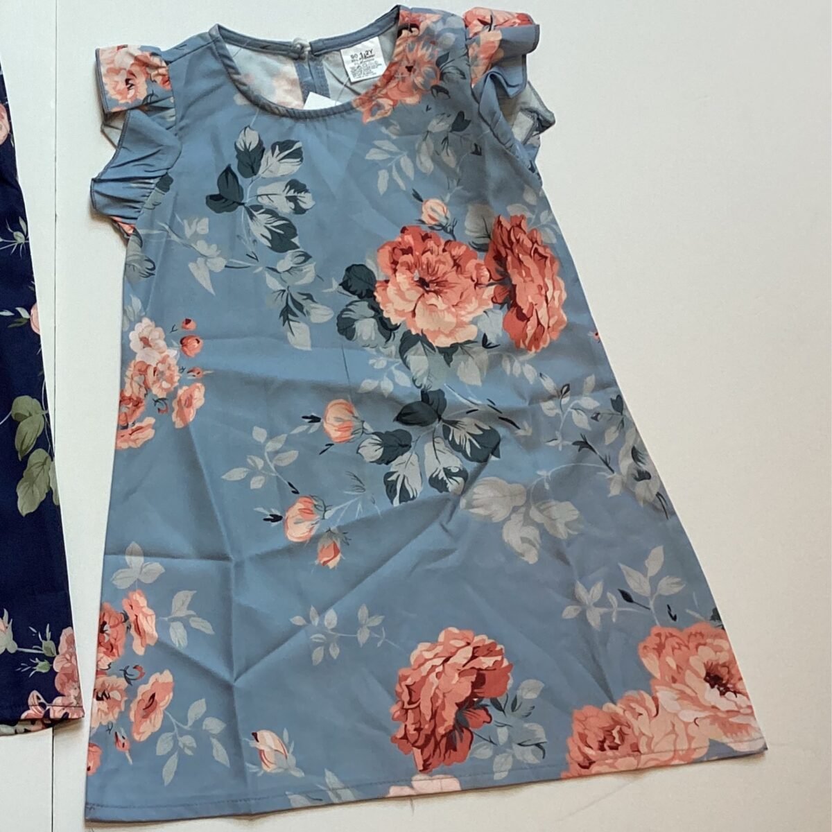 Step into sophistication with our Lt. Blue Floral Dress - a perfect blend of elegant design, flattering fit, and versatile style. Elevate your wardrobe with this must-have piece today!