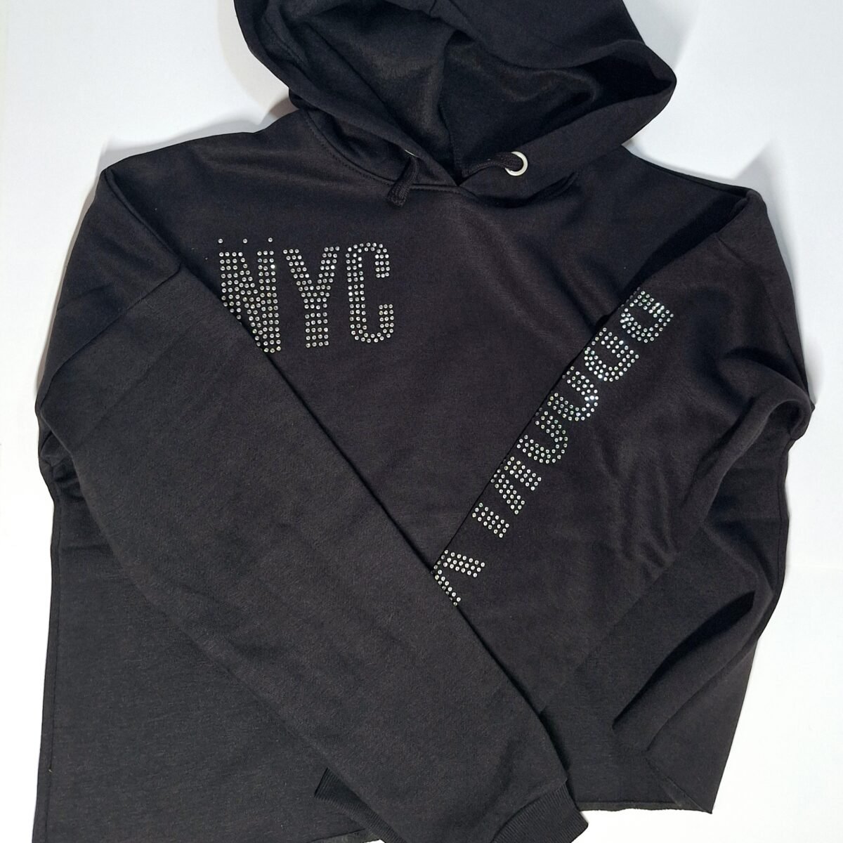 Elevate your style with the stylish and versatile Black NYC Hooded Top for girls. Made with premium quality materials, this top is a must-have for fashion-forward young trendsetters.