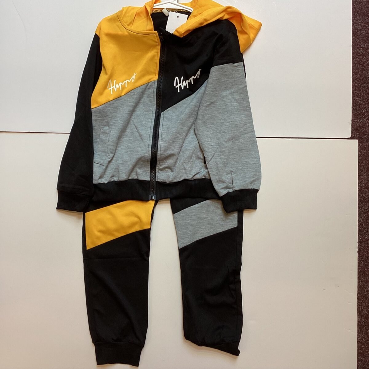 Elevate your athleisure game with this trendy Yellow/Grey Tracksuit. With its stylish color combination, comfortable fit, and versatile design, this tracksuit is a must-have for your wardrobe.