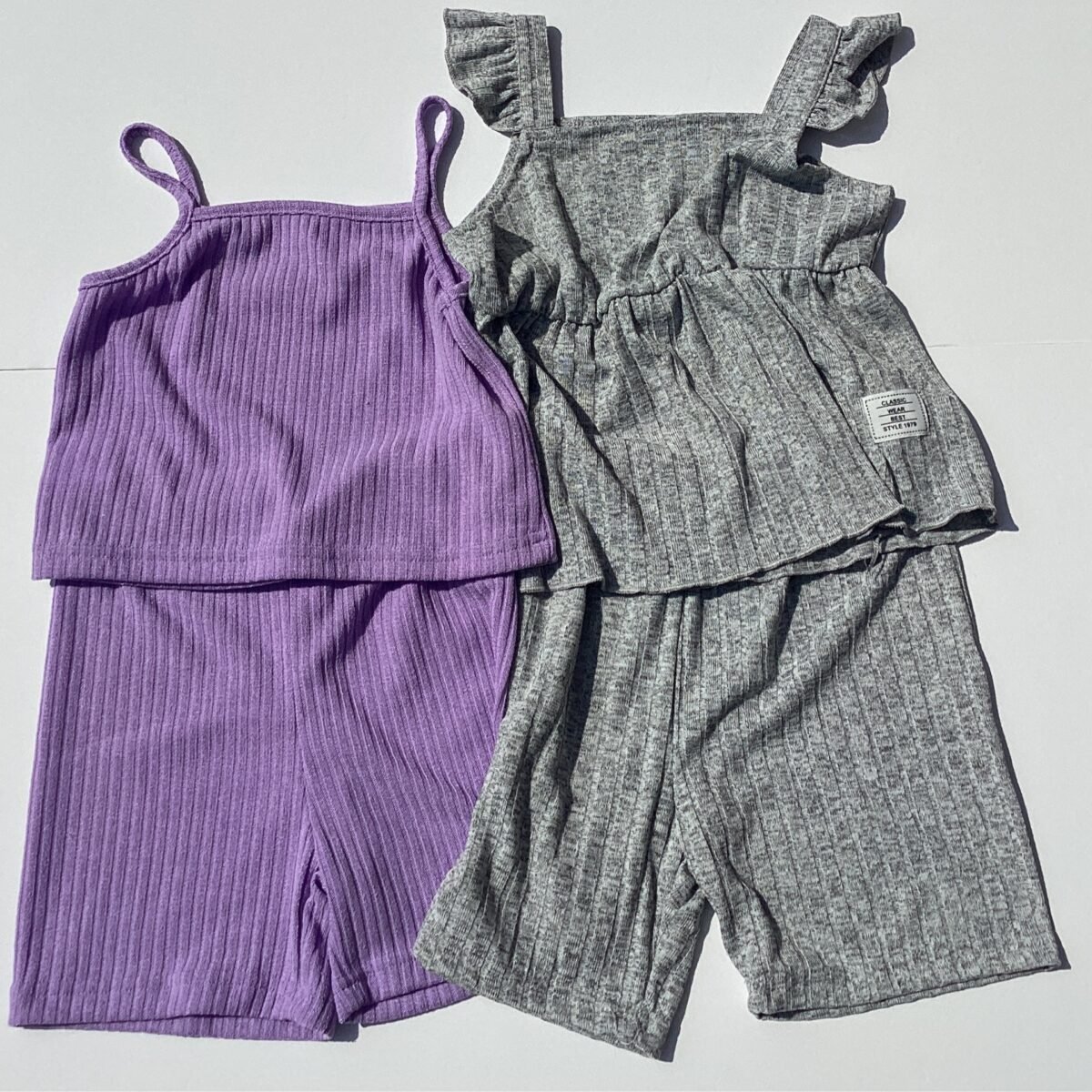 Elevate your little girl's wardrobe with our Rib style shorts set featuring slim straps. Comfortable, stylish, and perfect for any occasion - a must-have addition for her trendy look!