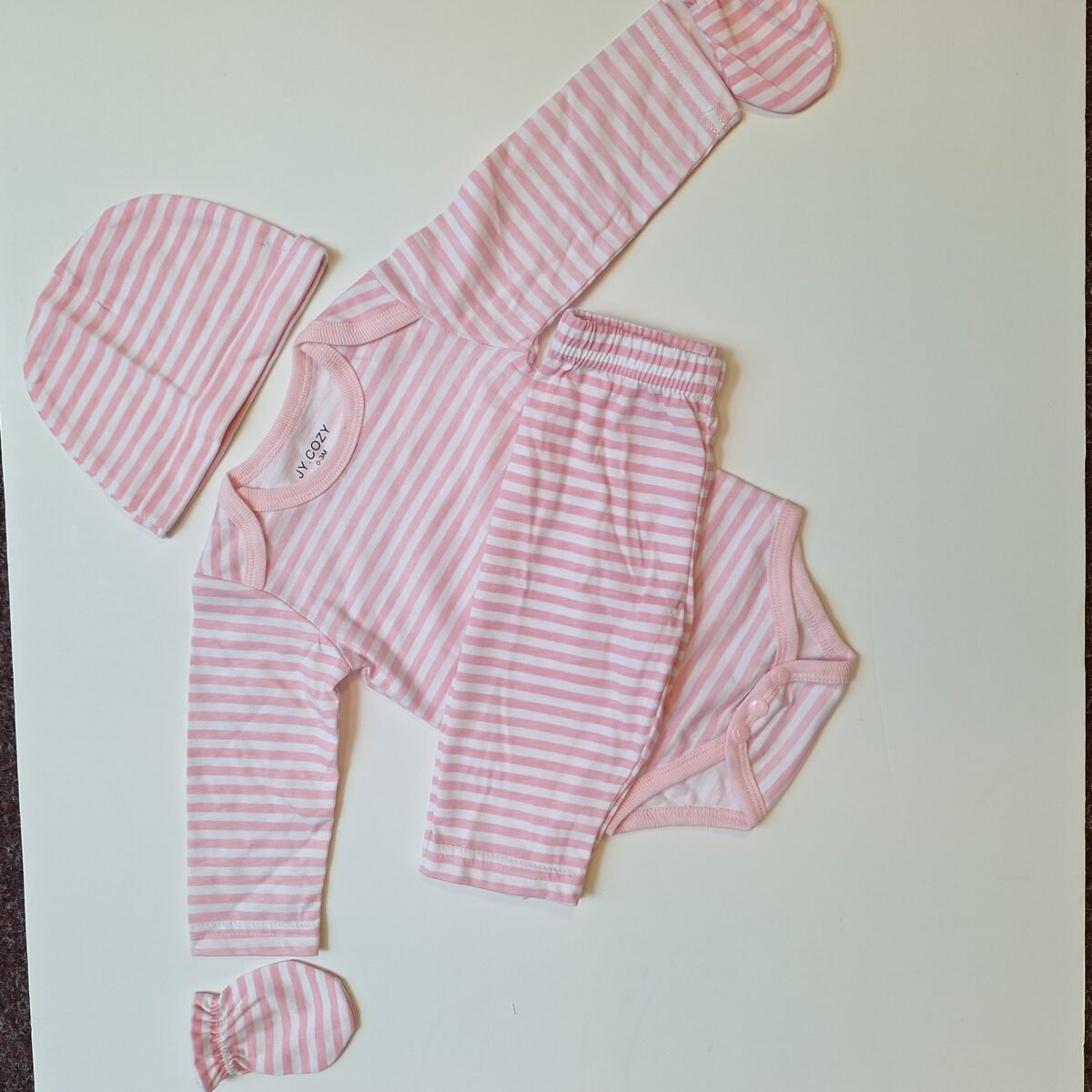 Indulge in the luxurious comfort of our Pink Thin Stripe Bodysuit. With a stylish thin stripe design and versatile long sleeves, this bodysuit is the perfect addition to your wardrobe for effortless style and comfort.