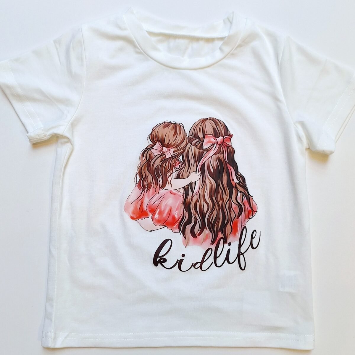 Wrap your little one in comfort with this soft cotton Girls White T-Shirt Kidlife. Featuring an adorable design, it's the perfect choice for stylish and happy kids!