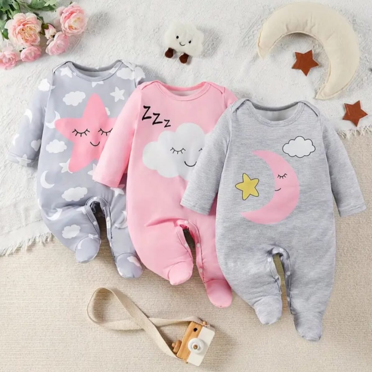 Wrap your little angel in the cozy cuteness of these Baby Girls Long-Sleeved Sleep Suits featuring an adorable cloud print. Made from comfortable fabric, this convenient 3-pack ensures your baby stays snug and stylish all night long.