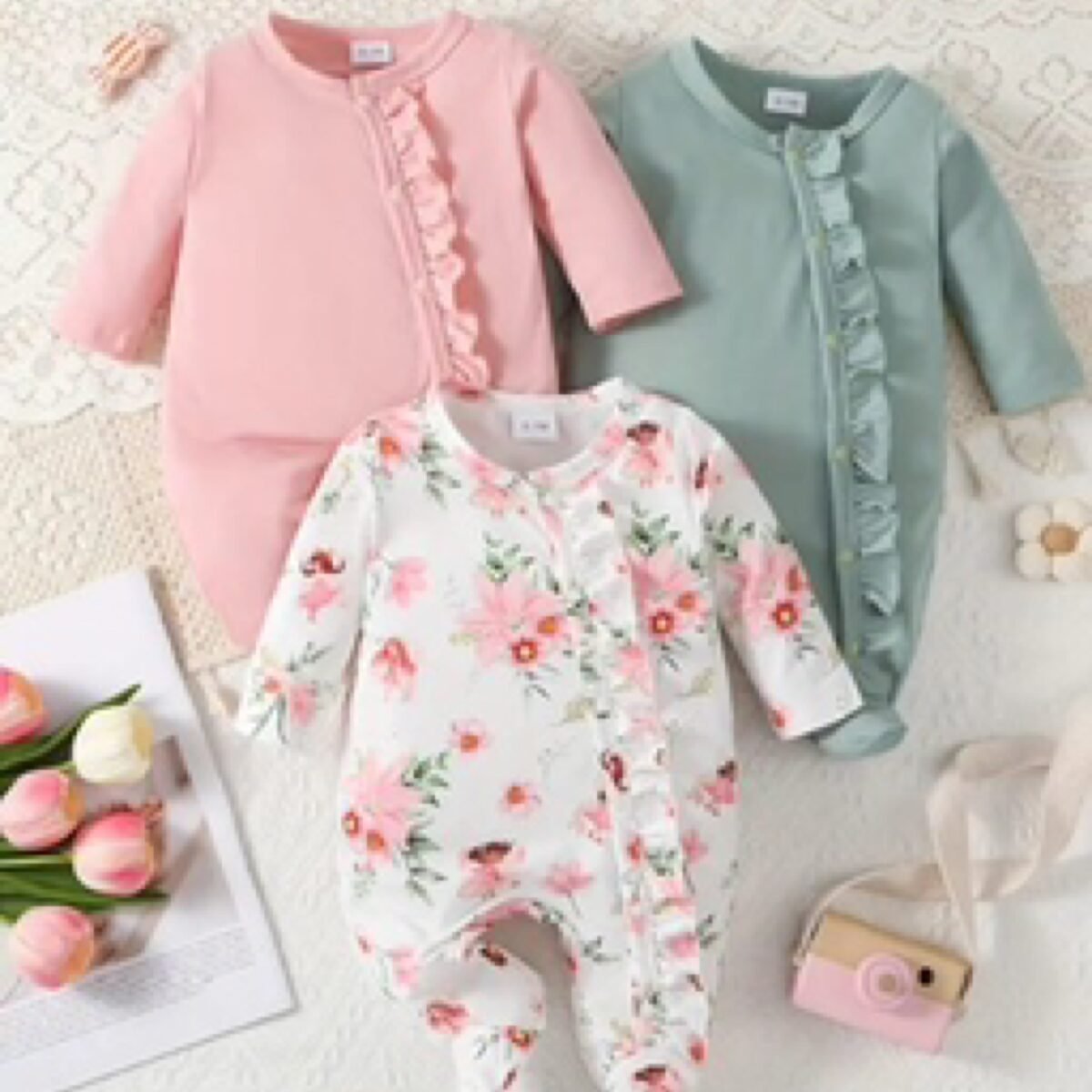 Get the perfect combination of comfort and cuteness with this 3-pack of baby girls' onesies! Made from cozy materials and featuring a charming frill trim design, these onesies are a convenient and adorable choice for your little one. Order now for your 0-1 month baby girl!